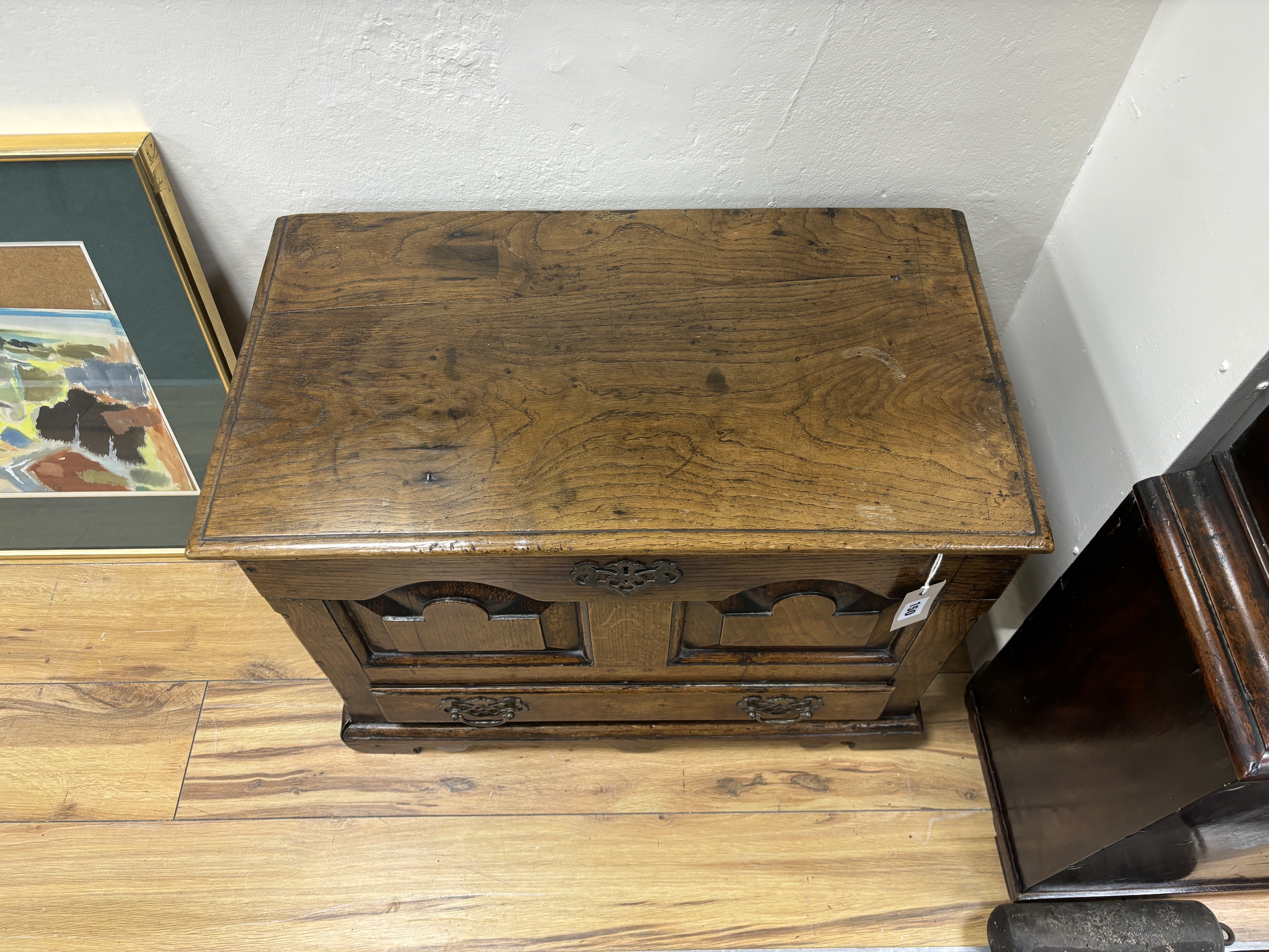 A mid 18th century Welsh oak coffer back with twin panelled front, width 65cm, depth 36cm, height 47cm.